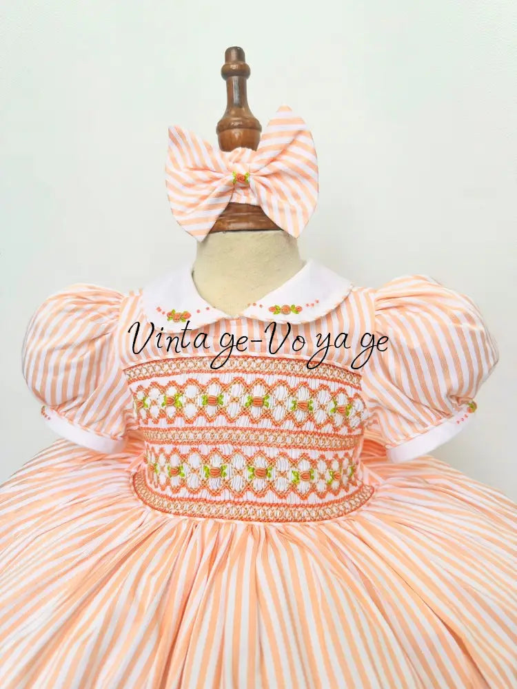 PRE-ORDER & GET NEXT WEEK! NEW! EMMA PEACHY/ORANGE STRIPES HAND-SMOCKED🧵🪡DRESS,PANTIES(3M-24M) & HAIR ACCESSORIES🎀 Baby