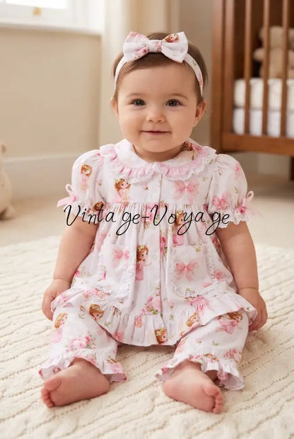Baby model wearing the fairy pyjama set with a matching bow headband