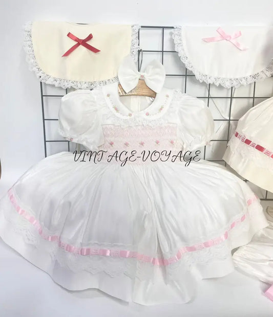PRE-ORDER NOW & GET NEXT WEEK! NEW! MELODY WHITE & PINK HAND-SMOCKED🧵🪡DRESS,BIB,BLOOMERS & HEADBAND OR BOWS🎀🎀 0-3
