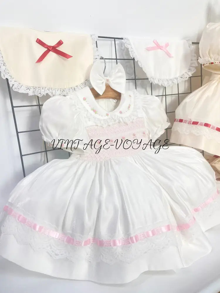 PRE-ORDER NOW & GET NEXT WEEK! NEW! MELODY WHITE & PINK HAND-SMOCKED🧵🪡DRESS,BIB,BLOOMERS & HEADBAND OR BOWS🎀🎀 Baby &