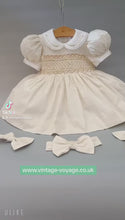 Load and play video in Gallery viewer, &quot;VANESSA&quot; CREAM Hand-Smocked Dress &amp; Hair Accessories TWO LEFT
